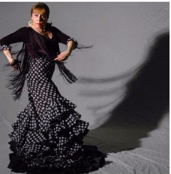 Carolina Lugo in a black and white polka dot bata de cola