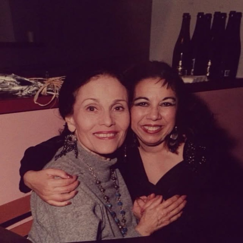 Lola Montes and Rosa Montoya hugging and smiling