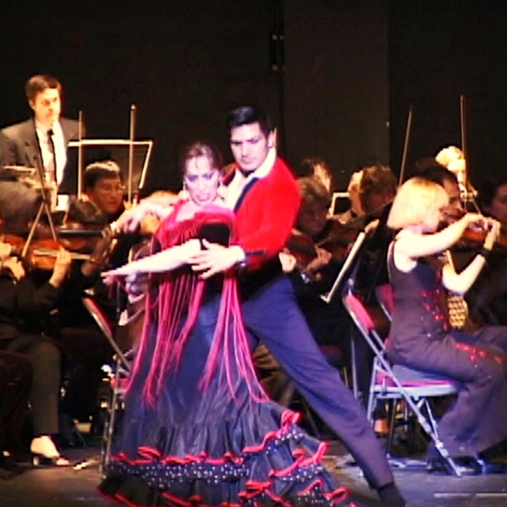Carolina Lugo and CarOlé Flamenco performing with an orchestra