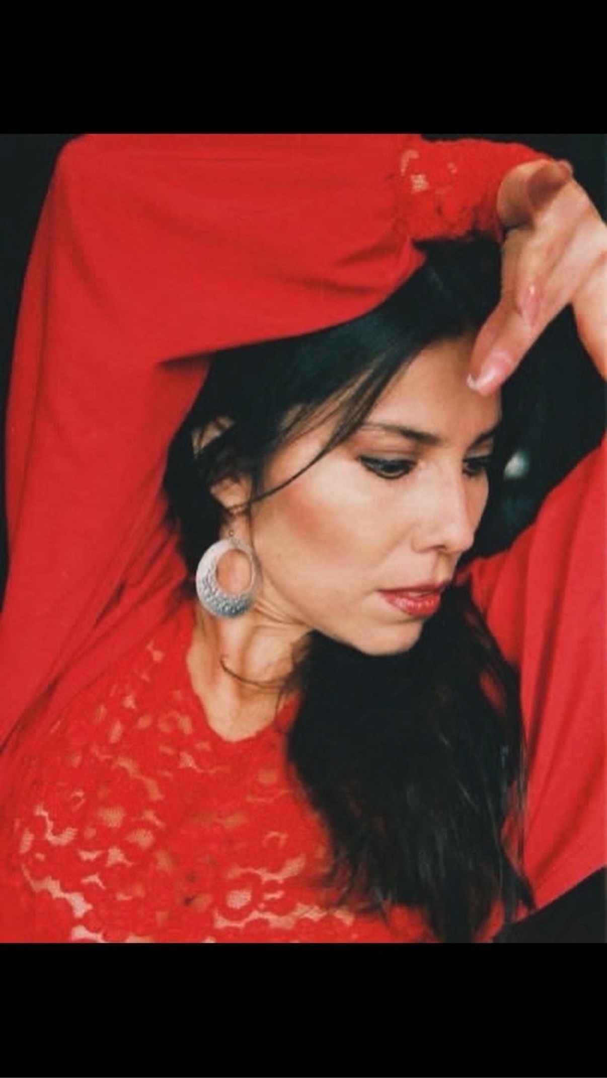 Pamela Martinez, flamenco dancer in a red lace dress