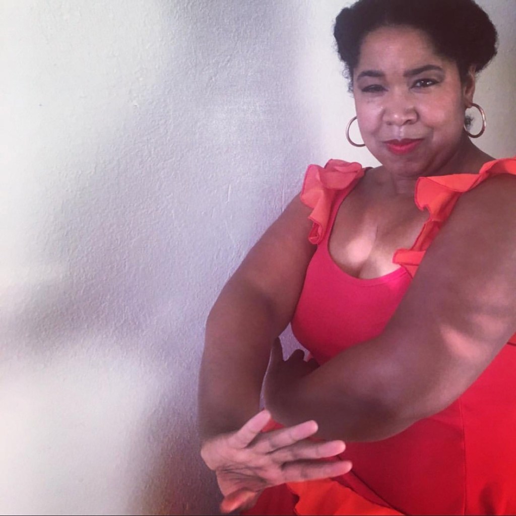 Zanonda Keys, flamenco dancer in an orange dress